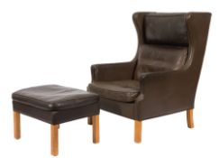 An Art Deco style beechwood frame wing armchair and matching stool:,