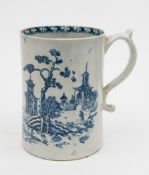A late 18th century pearlware blue and white tankard: with double scroll handle,