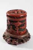 A Chinese cinnabar lacquer box and cover: of cylindrical outline,