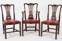 A set of eight late 19th Century carved mahogany dining chairs in the Hepplewhite taste:,