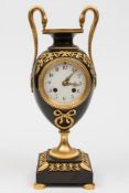 A French bronze and ormolu mantel clock: the eight-day duration movement striking the hours and