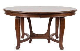 A French carved walnut dining suite of Art Nouveau design:,