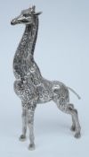 A 20th century Spanish silver model of a giraffe: with raised head and neck, 31cm. high, 17.61ozs.