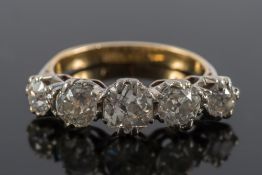 A diamond five stone ring: with graduated, old-cut diamonds approximately 0.25ct, 0.55ct, 0.80ct, 0.
