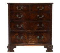 A carved mahogany serpentine fronted chest in the Chippendale taste:,