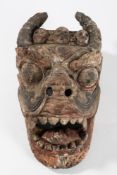 A Nepalese polychrome and gesso decorated mask: of a horned devil with flared nostrils,