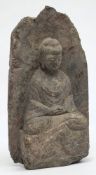 An Indian carved sandstone figure of a seated deity: wearing flowing robes, 39cm. high.