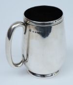 A Victorian silver mug, maker Josiah Williams & Co, Exeter 1878: of plain cylindrical form,