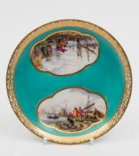 A Meissen turquoise-ground saucer: painted with panoramic harbour scenes within two gilt framed