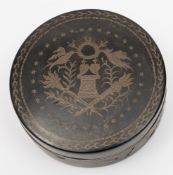 A 19th century tortoiseshell and inlaid circular box: the lid inlaid with birds, flaming torches,