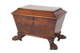 An early Victorian mahogany sarcophagus shaped cellarette:, with a hinged top and lion's claw feet,