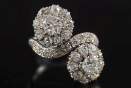 A diamond mounted cluster crossover ring: with two circular clusters,