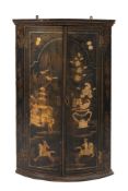 An 18th Century black lacquer and chinoiserie bow-fronted hanging corner cupboard:,