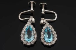 A pair of pear shaped aquamarine and diamond drop earrings: each with a single pear-shaped