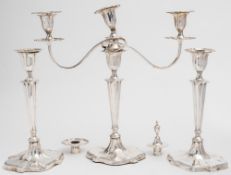 A  Victorian silver  twin-branch candelabra and two matching candlesticks, maker Hawksworth,