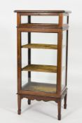 An Edwardian mahogany and inlaid upright bijouterie display cabinet:, crossbanded in satinwood,