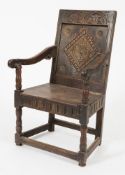 An early 18th Century carved oak open armchair:,