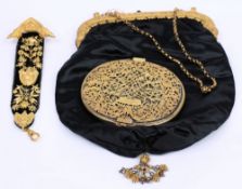 An 18th century oval gilt metal hand mirror: with hinged grille bearing a coronet, 11cm.