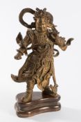 A 19th Chinese gilt bronze figure of Lokapala: the guardian standing in full traditional warrior's