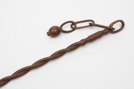 A South African walking stick : of spiral form with snuff bottle linked by chain to the pommel,