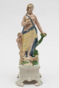 A pearl glazed figure of Ralph Wood type: modelled as a classical figure flanked by a dolphin and