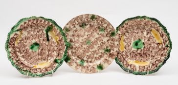 A pair of creamware plates of Whieldon type and one other: the former of silver shape with