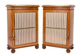 A pair of 19th Century satinwood dwarf side cabinets in the Regency taste:,