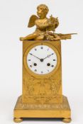 A French Empire ormolu mantel clock: the eight-day duration movement striking the hours and