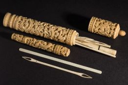 A 19th century Cantonese ivory bodkin holder: decorated with dragons, 16cm.