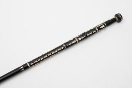 A Soloman Islands ebony  walking stick: inlaid with pearl shell geometric pattern decoration, 92cm.