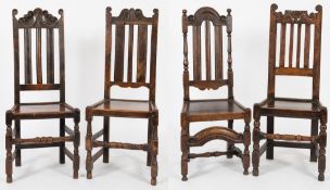A collection of eight 17th Century oak dining chairs:,
