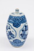 A Chinese blue and white spirit flask: of barrel form with slender spout,