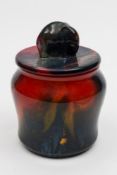 A Royal Doulton Flambe 'Sung' tobacco jar and cover:  with elephant finial,