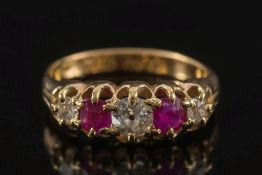 An 18ct gold, diamond and ruby five stone ring:,