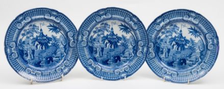 Three blue and white transfer decorated plates: of circular form decorated in the Summer House on a