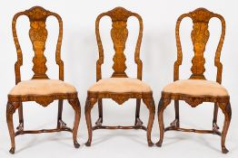 A set of three late 18th/early 19th Century Dutch walnut and floral marquetry dining chairs:,
