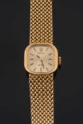 A lady's 18ct gold 'Rolex' wristwatch:, the cushion-shaped, gold dial with baton markers,