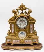 A large French ormolu and porcelain mantel clock: the eight-day duration movement striking the