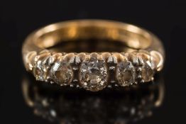 A gold and diamond five-stone ring: with graduated round old brilliant-cut diamonds estimated to