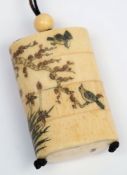 A Japanese bone four-division inro: decorated with finches amongst flowering shrubs, signed, 7.5cm.