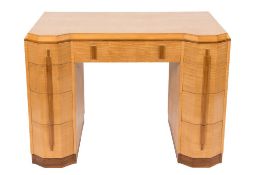 An Art Deco maple veneered kneehole desk or dressing table:,