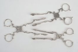 A pair of Georgian silver sugar nips,