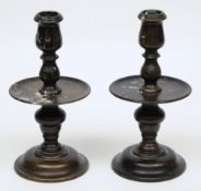A pair of 17th Century style bell metal candlesticks:,
