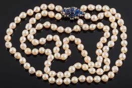 A cultured baroque pearl three-string necklace with sapphire and diamond cluster clasp:,