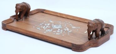 An early 20th century Indian teak and ivory inlaid serving tray: the centre inlaid with ivory and