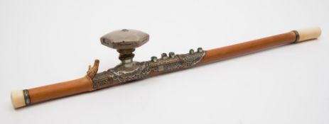 A Chinese bamboo opium pipe: with ivory end and mouthpiece, the white metal,