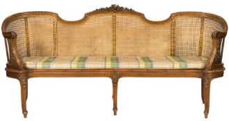 A French carved beechwood and gilt heightened canape:,