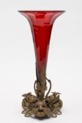 A Victorian gilt metal and cranberry trumpet shaped vase: of tapering form,