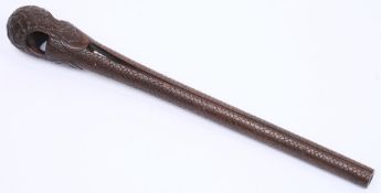 A Japanese carved hardwood parasol handle:, the stem decorated with scales,