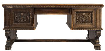 A matching late 19th/Early 20th Century German carved walnut kneehole desk:,